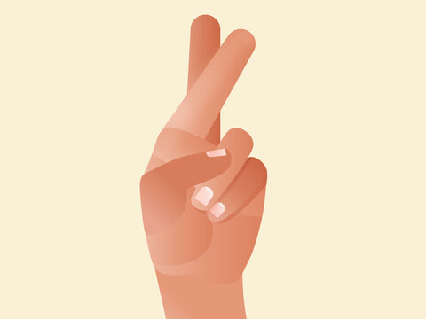 Hand crossing fingers wishing for good luck and hope