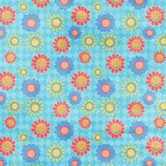 Colorful seamless floral pattern on blue textured background. Bright playful design ideal for fabric prints, wallpapers, children projects, and creative decorations.