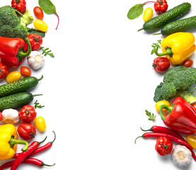 Fresh colorful vegetables creating border on white background