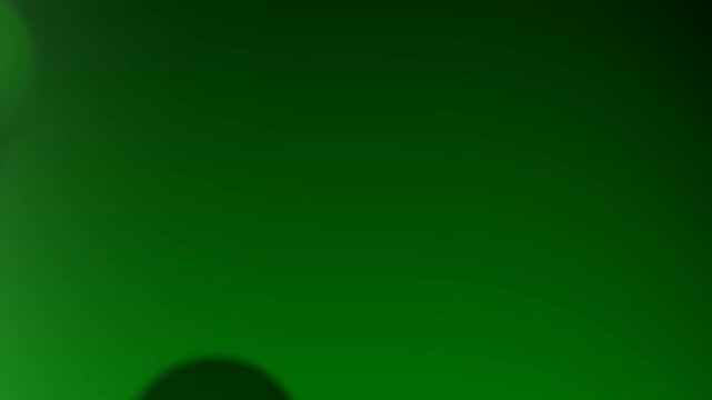 A smooth gradient of green hues interspersed with soft circular shapes and blurs