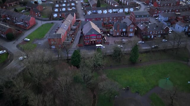 Aerial video of Heywood Park in Bolton, showcasing its community green spaces, bandstand, and refurbished playground.