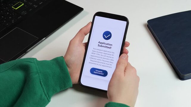 Detailed shot of a user scheduling a biometric appointment via a mobile app after submitting a passport form. Perfect for tech reviews, software demos, and modern lifestyle b-roll. High-quality