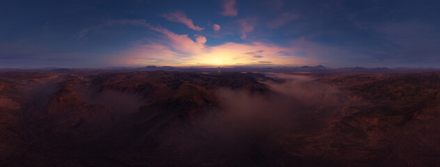 Panoramic Sunset Over Rugged Mountains With Fog And Desert Valleys At Dusk