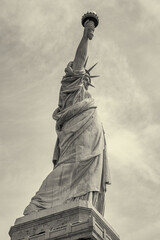 Fototapeta premium Statue of Liberty viewed from ferry boat crossing New York Harbor on sunny day