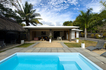 Modern luxury vacation villa with private swimming pool and tropical garden in Tamarin, Mauritius