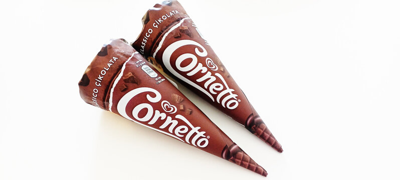 Delicious chocolate cornetto ice cream in a waffle cone with chocolate splashes 