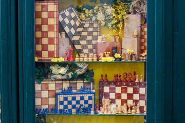 Wooden chess sets and boards displayed in souvenir shop window Prague Czech Republic