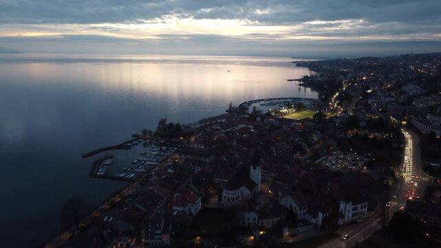 Aerial view of Lutry old town at dusk along Lake Geneva