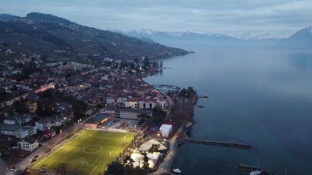 Aerial view of Lutry old town at dusk along Lake Geneva