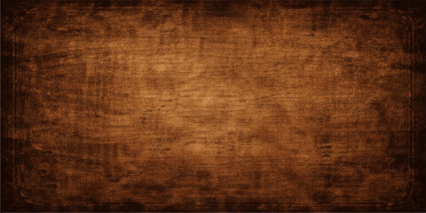 Fototapeta premium A dark antique backdrop featuring a rough aged wood texture with a brown grunge pattern on an old vintage parchment surface
