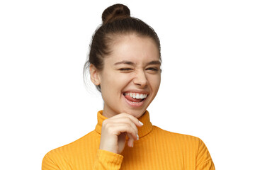 Woman winking playfully in yellow turtleneck with clear glasses