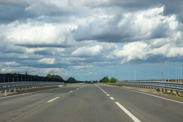 Highway under cloudy sky before storm
