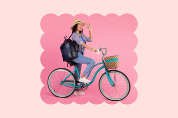 Naklejka premium A woman sits on a blue bicycle with a basket. She waves her hand cheerfully. The background is pink. She has a backpack on her back and is dressed in casual clothing.
