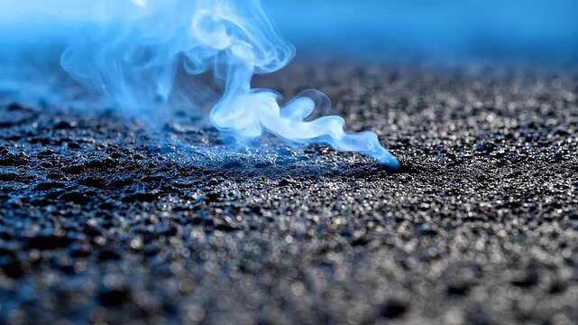 Blue smoke rising from textured surface