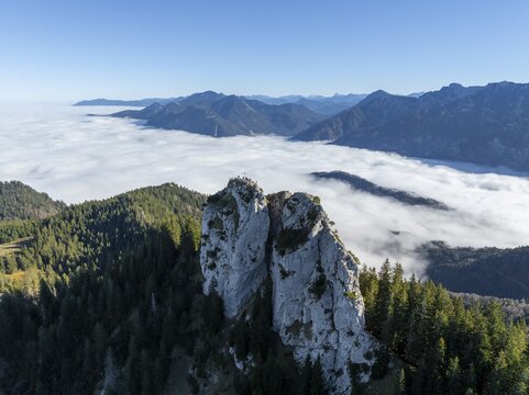 Aerial view, rocky summit of the Ettaler Manndl, view over mountain landscape and sea of clouds, high fog in the valley, Ammergau Alps, Bavaria, Germany