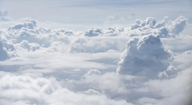 View over towering clouds, cloudy sky, aerial view from the plane