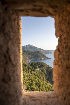 View from embrasure at Torre des Verger, stone tower on the coast, sea view, Banyalbufar, Majorca, Balearic Islands, Spain