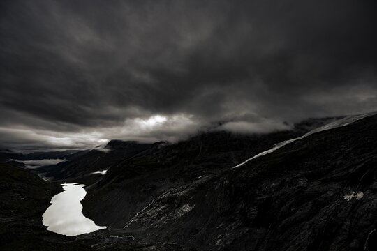 Mountain lake Lej da Vadrett with Val Rosegg and dramatic clouds, St Moritz, Engadin, Grisons, Switzerland