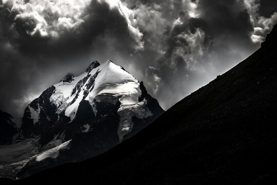 Piz Rosegg with Bernina Group and cloudy sky, St Moritz, Engadin, Grisons, Switzerland