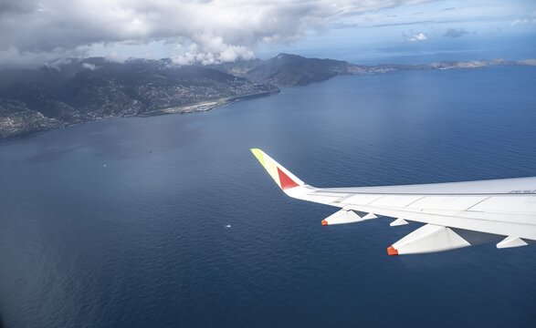 TAP Portugal, aeroplane wing, view out of the window to the sea, Madeira, Portugal