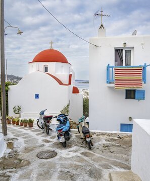 Small white Cycladic church Agios Spyridon, scooter parking in a small alley, Old Town Chora, Mykonos Town, Mykonos, Cyclades, Greece