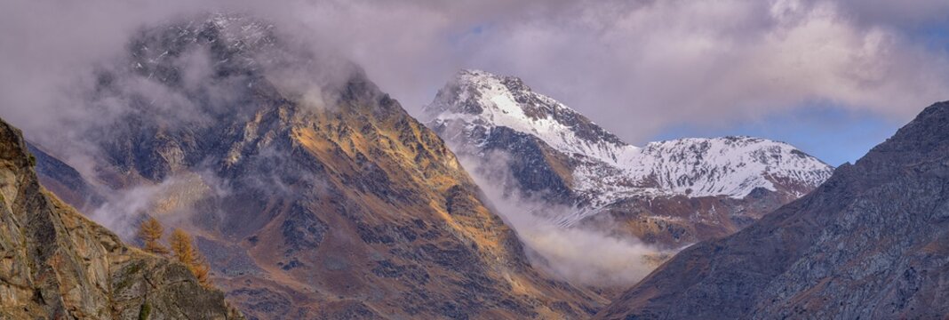 Foggy atmosphere in the high mountains, panorama, Gran Paradiso National Park, Aosta, Italy