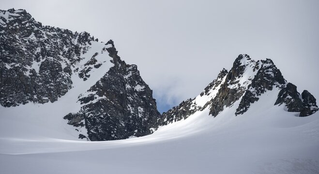Alpeiner Ferner, mountain ridge in winter with clouds and fog, Neustift im Stubai Valley, Tyrol, Austria