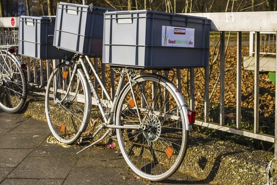Bicycle with plastic containers from foodsharing, food distributor, Cologne, North Rhine-Westphalia, Germany