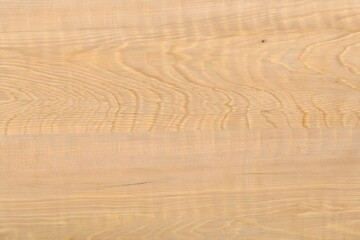 Fototapeta premium Natural light ash wood grain texture seamless background with subtle flowing waves and warm creamy beige natural figure patterns