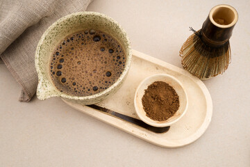 Preparing hojicha tea powder with chasen whisk