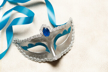 Blue and silver mask for celebration carnival. Jewish Purim or Mardi Gras. Space for text. Banner