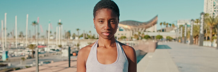 Portrait of an  woman in sportswear on the waterfront in summer. Panoramic © Andrii Nekrasov