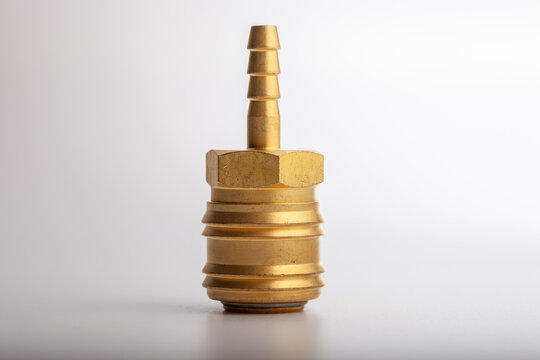 Industrial brass hose barb adapter with male threaded hex head for pneumatic plumbing systems and hydraulic gas fluid connection isolated on white background for repair hardware.