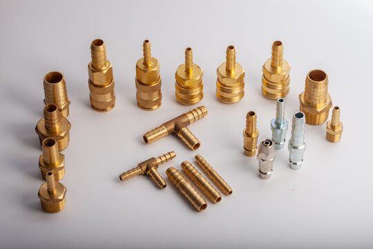 Heavy-duty brass one-way check valve with threaded connectors for industrial air compressor and plumbing systems, non-return valve isolated on white