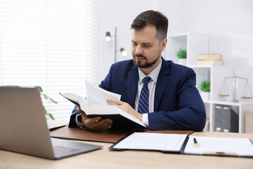 Fototapeta premium Notary working at wooden desk in office