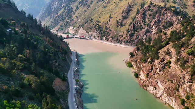 Drone Shot of Karcham Hydroelectric Dam with River and Rocky Mountains