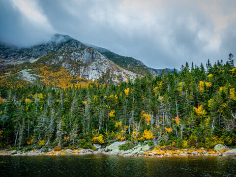 Chimney Pond trail hike at Baxter State Park, Maine, with peak fall foliage on an overcast cloudy day