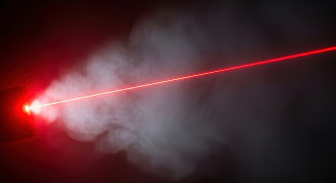 Powerful, coherent red laser beam projecting intensely across a dark, smoky environment, symbolizing future speed, technology, and precision optics, speed, abstract, smoke