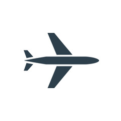 Obraz premium A minimalist vector graphic of an airplane in flight with a dark blue silhouette on a white background