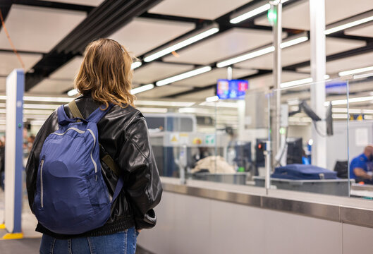 a woman at airport baggage control