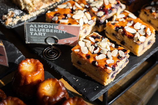 A cake display case in a cafe