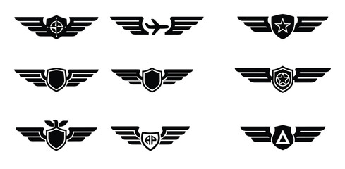 Set of winged emblems silhouettes military style badges aviation symbols shield with wings vector © GoDesigner