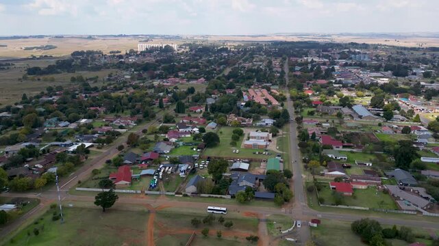 High altitude aerial hyperlapse of Ermelo city in Mpumalanga, capturing the vast Highveld horizon and urban residential town