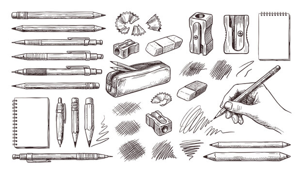 Drawing and writing tools collection with sketchbook and hand