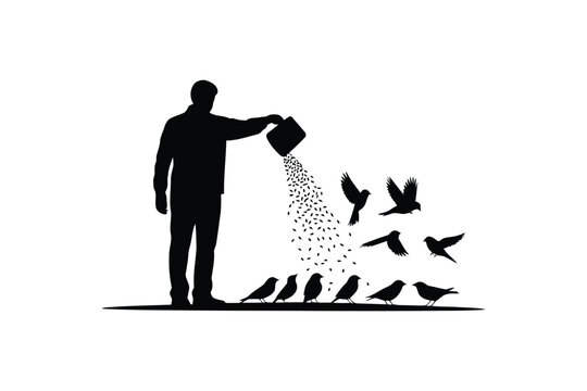 Silhouette of a person feeding birds with seeds from a container in black and white