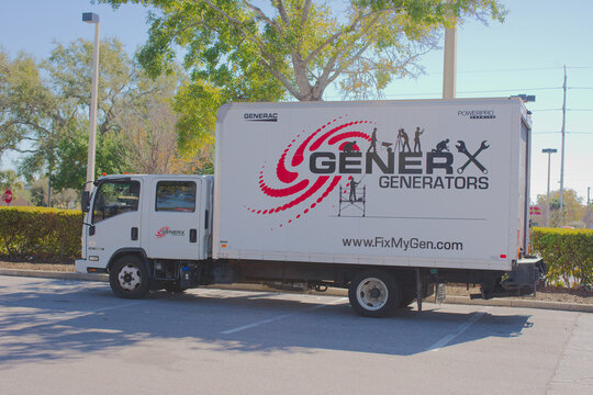 Branding Generac Generators Truck On Street For Mobile Power And Generator Services. Editorial Use Only Feb 9 , 2026 St. Petersburg, FL USA. White delivery truck featuring a large Generac Generators g