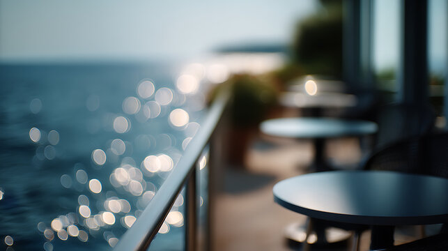 Scenic view of a terrace overlooking the tranquil sea, with tables set for a delightful experience. The ambiance is perfect for relaxation and enjoyment