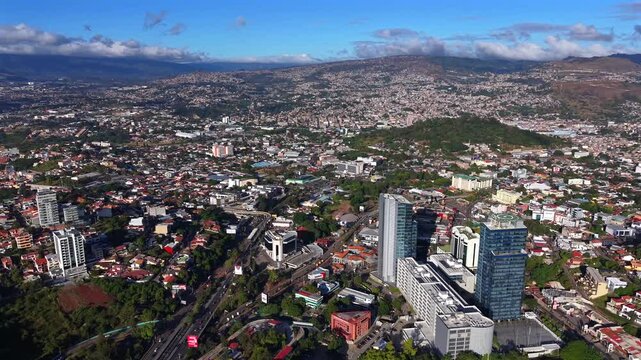 Beautiful aerial night view of Tegucigalpa, capital of Honduras and Comayaguela, surrounded by mountains and the city glowing across the urban valley