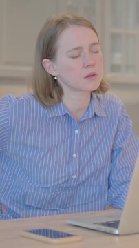 Young Woman with Back Pain Working on Laptop