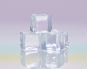 Ice cubes arranged on a reflective surface with soft lighting and pastel background colors for commercial drink advertising and product shots with copy space